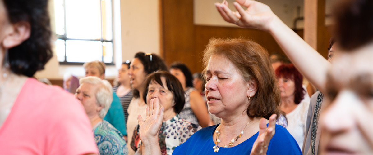 Women of Hope participants worshipping